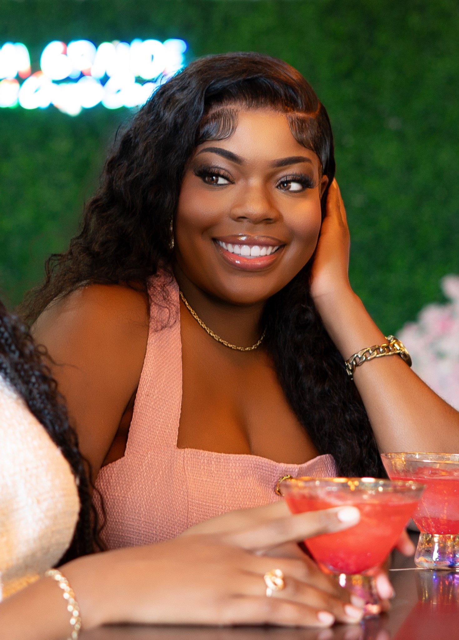 Pink Frosting founder smiling in a pink outfit